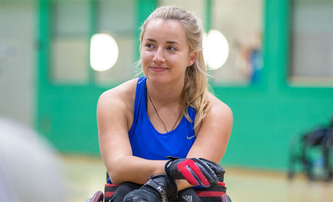 a photo of our client issy sat in her wheelechair after playing wheelchair rugby